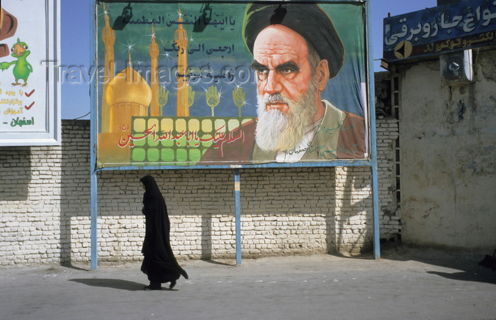 iran457: Iran - Qom: woman under billboard with Ayatollah Ruhollah Khomeini - photo by W.Allgower - (c) Travel-Images.com - Stock Photography agency - Image Bank
