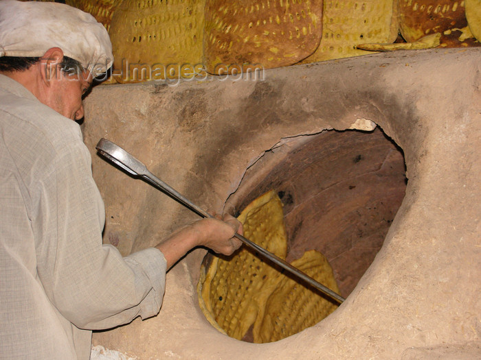 iran538: Yazd, Iran: baker and tandoor oven with bread on the walls - bakery - photo by N.Mahmudova - (c) Travel-Images.com - Stock Photography agency - Image Bank