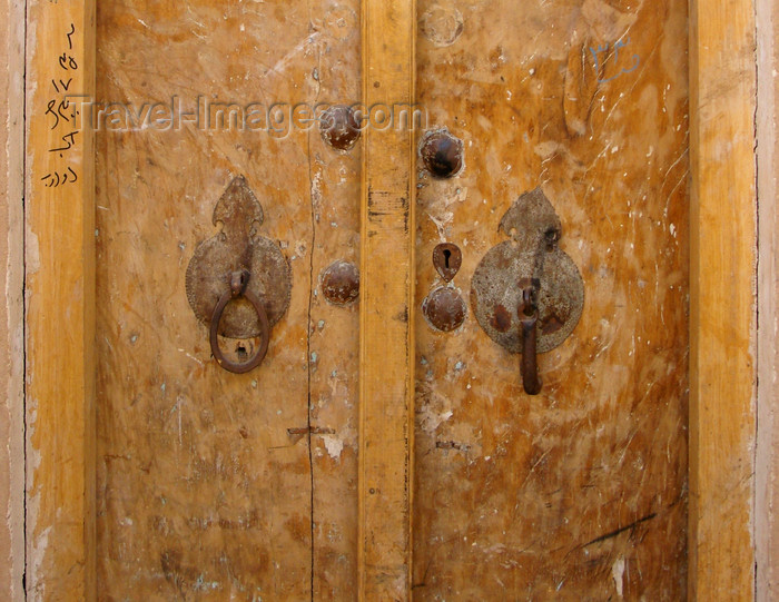 iran542: Yazd, Iran: houses have segregated door knockers - on the left with a hole for women and the one on the right, cylindrical, for men - these have different sounds, informing on the gender of the visitor - photo by N.Mahmudova - (c) Travel-Images.com - Stock Photography agency - Image Bank
