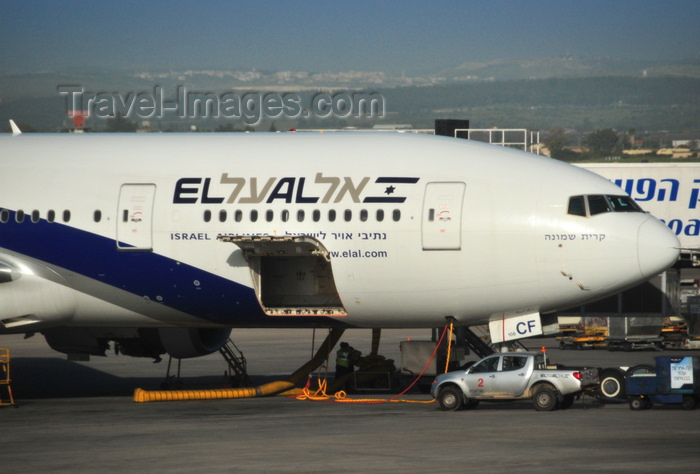 israel100: Tel Aviv Ben Gurion Airport, Central District, Israel: El Al Israel Airlines Boeing 777-258(ER), registration 4X-ECF (cn 36084) - aircraft with cargo door open at Terminal 3 - Mitsubishi pick-up - photo by M.Torres - (c) Travel-Images.com - Stock Photography agency - Image Bank