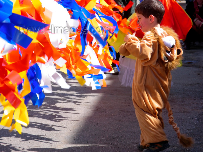 israel394: Israel: toddler dressed-up for Purim celebrations, playing with colored stripes - photo by E.Keren - (c) Travel-Images.com - Stock Photography agency - Image Bank