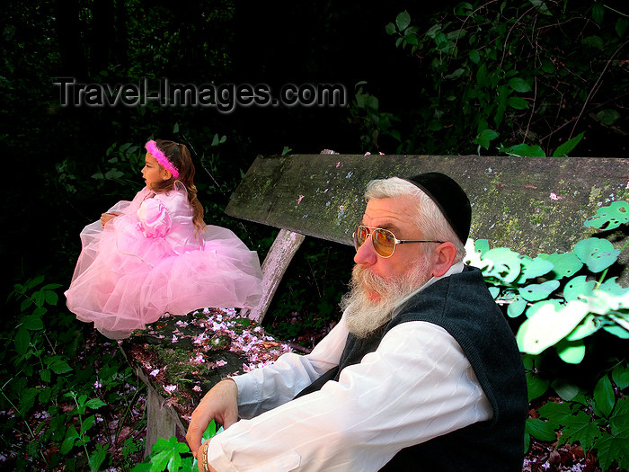 israel395: Israel: the ages - conceptual view of old jew and smal girl in pink dress sitting on a old wooden bench - photo by E.Keren - (c) Travel-Images.com - Stock Photography agency - Image Bank