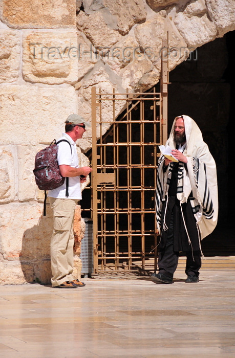 israel401: Jerusalem,  Israel: secular man with a backpack and an Orthodox Jew covered in a Kosher wool Tallit prayer shawl - Western Wall plaza - photo by M.Torres - (c) Travel-Images.com - Stock Photography agency - Image Bank