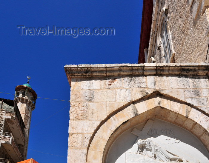 israel452: Jerusalem, Israel: Via Dolorosa, Armenian-Polish Catholic Chapel at the third station -  Armenian Catholic Patriarchate - bas relief sculpture of Jesus carrying the cross - on the left the minaret of the Darghat mosque, El-Wad road - photo by M.Torres - (c) Travel-Images.com - Stock Photography agency - Image Bank