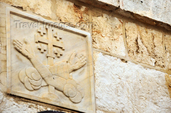 israel453: Jerusalem, Israel: Via Dolorosa, Station 5, carving of Franciscan arms with Jerusalem cross - Fransciscan Order symbol - photo by M.Torres - (c) Travel-Images.com - Stock Photography agency - Image Bank