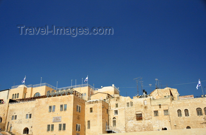 israel471: Jerusalem, Israel: stone buildings - view from the Western Wall plaza, Yeshivat Netiv Aryeh - Zionist Orthodox yeshiva - flags and antennas - Jewish quarter - Blue sky background as copy space for your text - photo by M.Torres - (c) Travel-Images.com - Stock Photography agency - Image Bank
