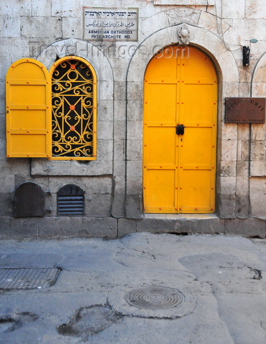 israel488: Jerusalem, Israel: ancient façade of a former burghul factory, with yellow door and window on Armenian Orthodox Patriarchate Road - Bulghourji Armenian Restaurant and Lounge - wrought Iron Latticework - Armenian quarter - photo by M.Torres - (c) Travel-Images.com - Stock Photography agency - Image Bank