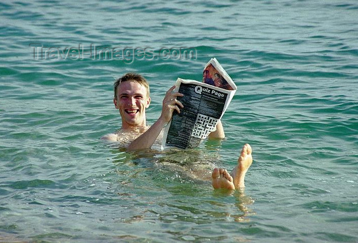 israel75: Israel - Dead sea: reading a newspaper while floating - buoyancy caused by high salinity - photo by J.Kaman - (c) Travel-Images.com - Stock Photography agency - Image Bank