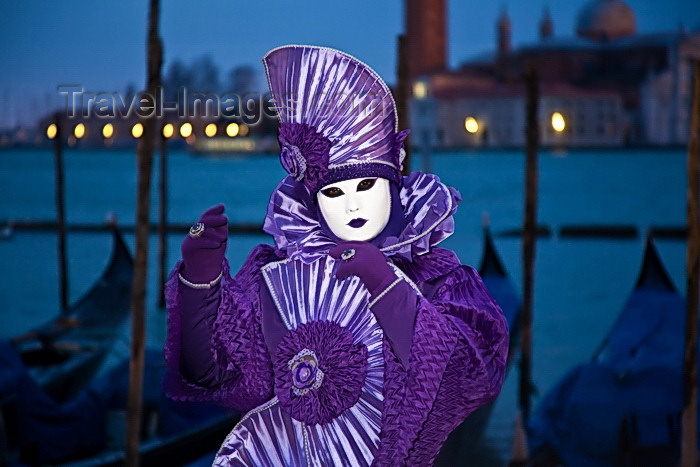 italy513: Carnival participant with Carnival costume at Dawn by Canale di San Marco, Venice - photo by A.Beaton - (c) Travel-Images.com - Stock Photography agency - Image Bank