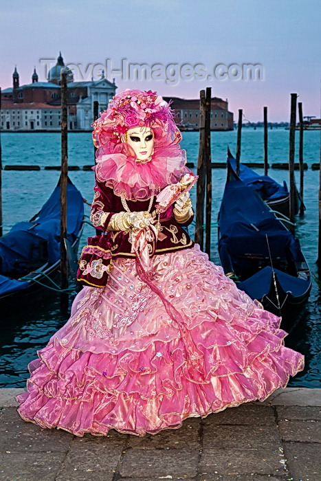 italy514: Carnival participant with Carnival costume at Dawn by Canale di San Marco, Venice - photo by A.Beaton - (c) Travel-Images.com - Stock Photography agency - Image Bank