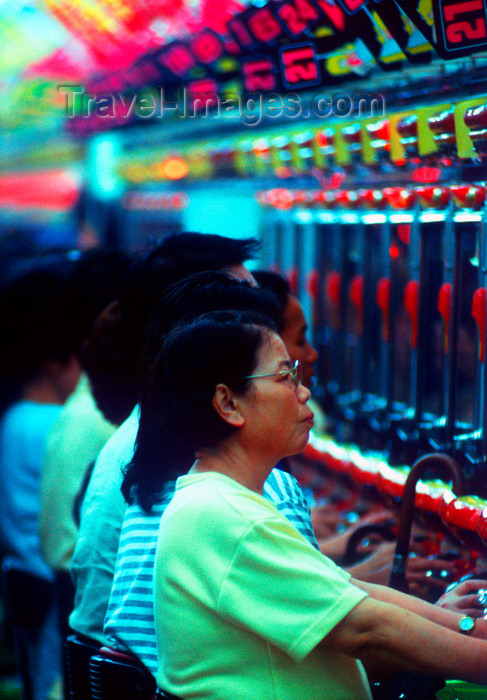 japan84: Pachinko game hall interior - players, Tokyo, Japan. photo by B.Henry - (c) Travel-Images.com - Stock Photography agency - Image Bank