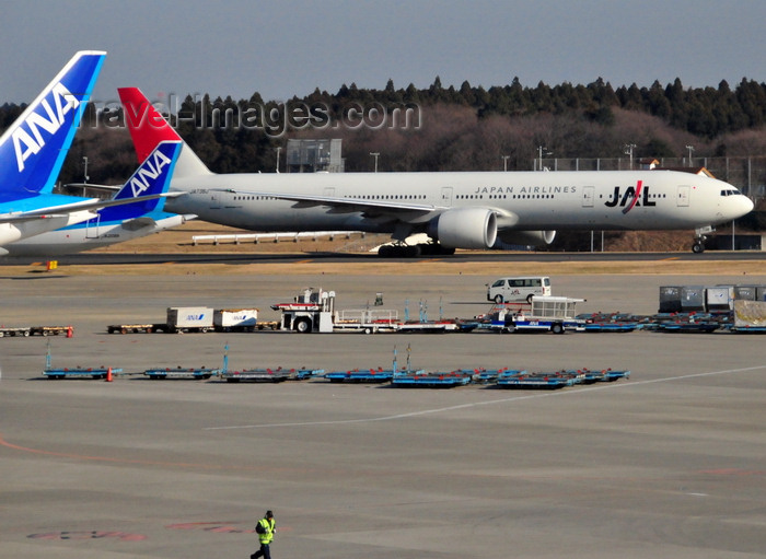 japan95: Narita, Chiba Prefecture, Japan: Narita International Airport (Tokyo Narita - NRT) - Japan Airlines (JAL) Boeing 777-346 (ER) cn 32436 taxiing before take off - tails of ANA aircraft on the left - photo by M.Torres - (c) Travel-Images.com - Stock Photography agency - Image Bank