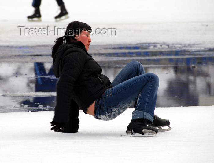 kazakhstan159: Kazakhstan,Medeu ice stadium, Almaty: a girl recovers from a fall - photo by M.Torres - (c) Travel-Images.com - Stock Photography agency - Image Bank