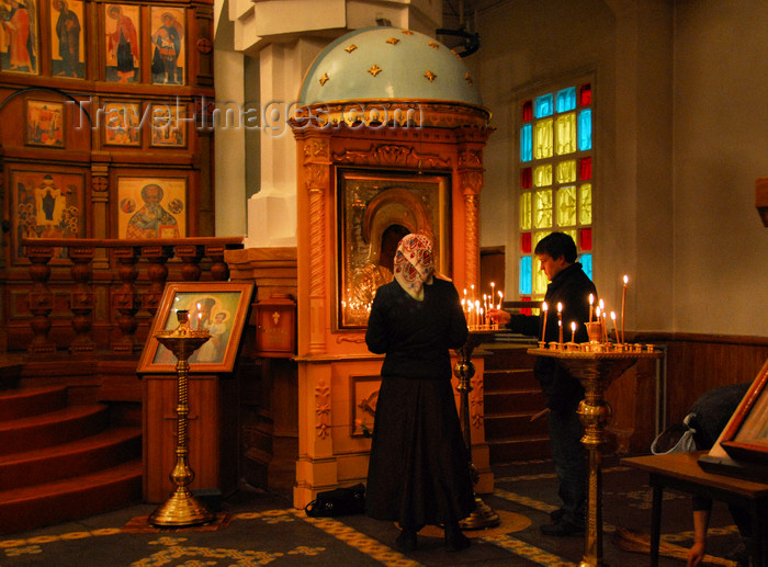 kazakhstan247: Kazakhstan, Almaty:  Holy Ascension Russian Orthodox Cathedral - lighting candles - photo by M.Torres - (c) Travel-Images.com - Stock Photography agency - Image Bank