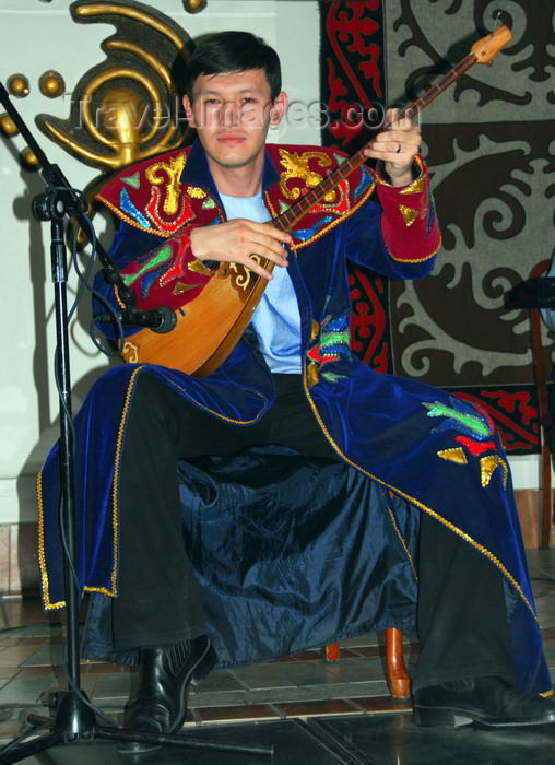 kazakhstan328: Kazakhstan, Central Asia - Almaty: playing a traditional dombra, a long-necked, stringed instrument - photo by M.Torres - (c) Travel-Images.com - Stock Photography agency - Image Bank