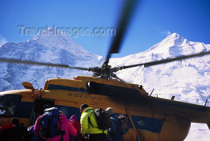 kazakhstan56: Kazakhstan - Tian Shan mountain range: mountaineers board a russian Mil Mi-8 Hip helicopter to leave from the Khan-Tengri base camp - photo by E.Petitalot - (c) Travel-Images.com - Stock Photography agency - Image Bank