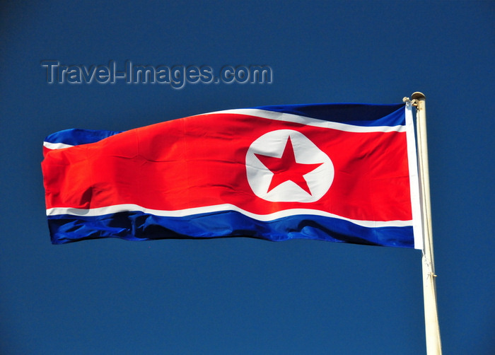 korean16: Pyongyang, North Korea / DPRK: the flag of the Democratic People's Republic of Korea flies in a deep blue sky - photo by M.Torres - (c) Travel-Images.com - Stock Photography agency - Image Bank