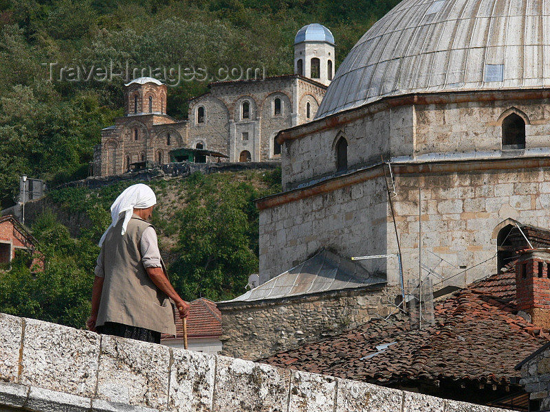 kosovo3: Kosovo - Prizren / Prizreni: woman on the bridge and dome of the Sinan Pasha mosque - photo by J.Kaman - (c) Travel-Images.com - Stock Photography agency - Image Bank