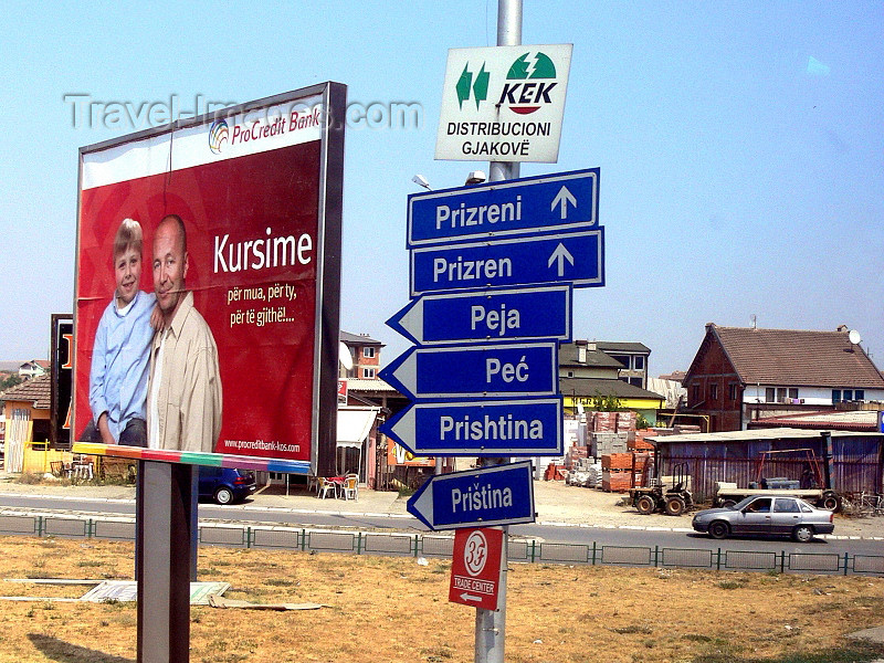 kosovo69: Kosovo - Bank billboard and direction boards by the road - photo by J.Kaman - (c) Travel-Images.com - Stock Photography agency - Image Bank