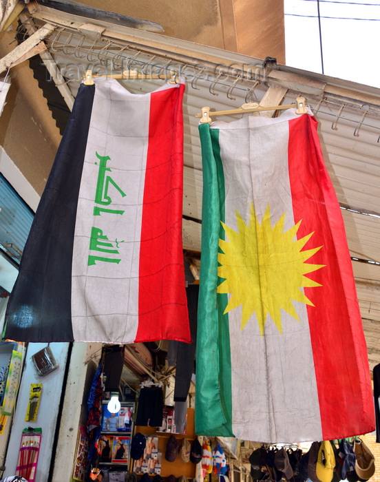 kurdistan116: Erbil / Hewler / Arbil / Irbil, Kurdistan, Iraq: flags of Iraq and Kurdistan hang side by side outside a shop in the old town - photo by M.Torres - (c) Travel-Images.com - Stock Photography agency - Image Bank