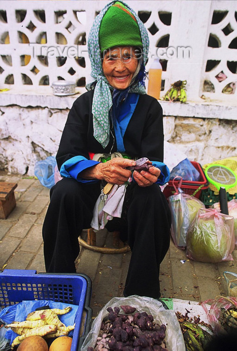 laos114: Laos: a smiling old woman is selling food at the market - photo by E.Petitalot - (c) Travel-Images.com - Stock Photography agency - Image Bank