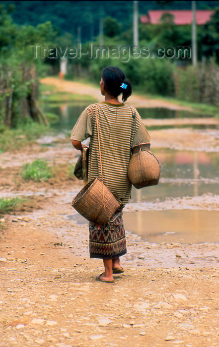 laos70: Laos - Vang Vieng - woman walking with jars - photo by K.Strobel - (c) Travel-Images.com - Stock Photography agency - Image Bank