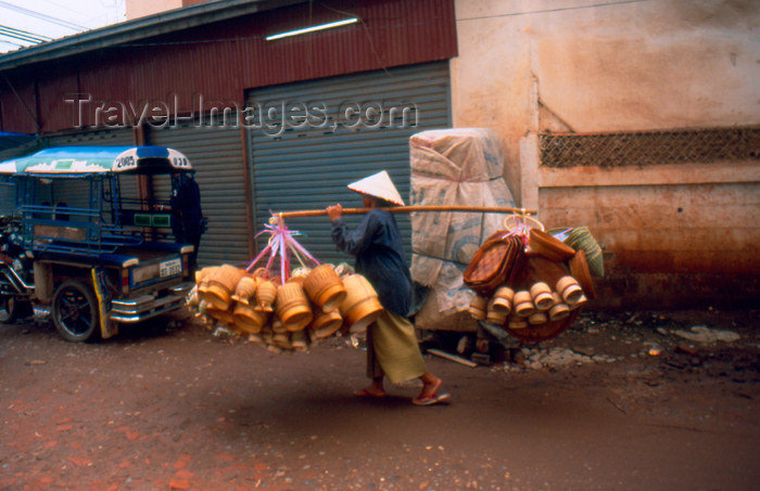 laos71: Laos - Vientiane - Man transporting rice baskets (photo by K.Strobel) - (c) Travel-Images.com - Stock Photography agency - Image Bank