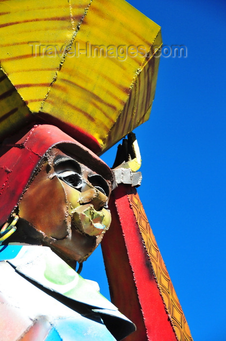 lesotho2: Maseru, Lesotho: painted metal sculpture of a woman with a basket on her head - LNDC Centre - photo by M.Torres - (c) Travel-Images.com - Stock Photography agency - Image Bank
