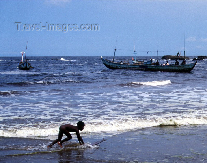 liberia12: Grand Bassa County, Liberia, West Africa: Buchanan - incipient surfer on the beach - photo by M.Sturges - (c) Travel-Images.com - Stock Photography agency - Image Bank
