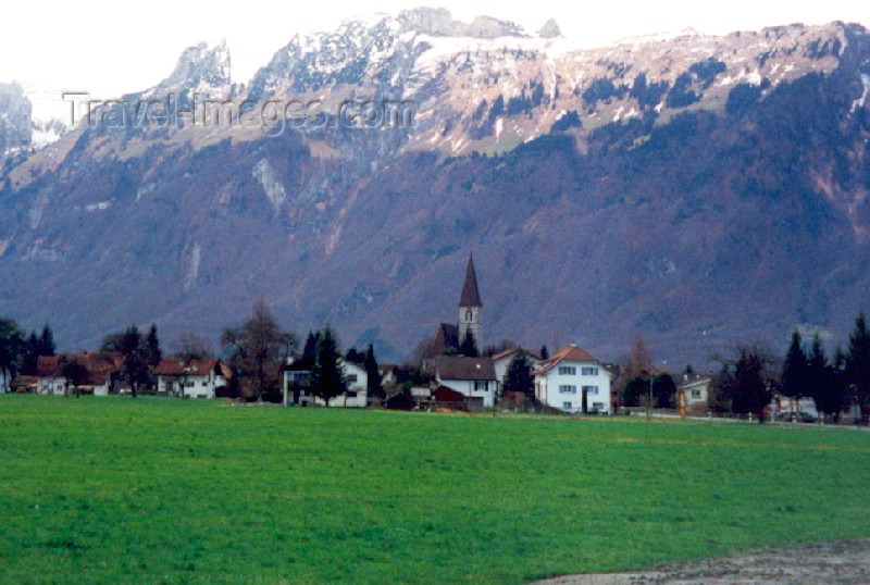 liech38: Liechtenstein - Ruggell: from the fields - St. Fridolin's Parish Church - Swiss Alps in the background (photo by M.Torres) - (c) Travel-Images.com - Stock Photography agency - Image Bank