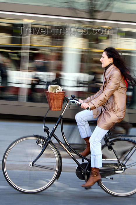 lithuania156: Lithuania - Vilnius: woman riding a bicycle - Gediminas' avenue - photo by Sandia - (c) Travel-Images.com - Stock Photography agency - Image Bank
