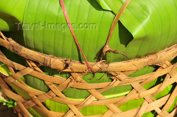 madagascar150: Soanierana Ivongo, Analanjirofo, Toamasina Province, Madagascar: Malagasy 'cargo container' using a basket and banana leaves - photo by M.Torres - (c) Travel-Images.com - Stock Photography agency - Image Bank