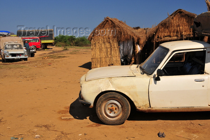 madagascar210: Tsimafana, Belo sur Tsiribihina district, Menabe Region, Toliara Province, Madagascar: huts and battered Peugeot 504 pickup -  European Car of the Year in 1969 - photo by M.Torres - (c) Travel-Images.com - Stock Photography agency - Image Bank