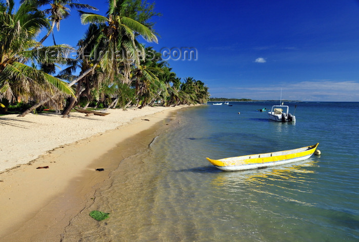 madagascar57: Vohilava, Île Sainte Marie / Nosy Boraha, Analanjirofo region, Toamasina province, Madagascar: canoe and coconut lined beach - looking south - photo by M.Torres - (c) Travel-Images.com - Stock Photography agency - Image Bank