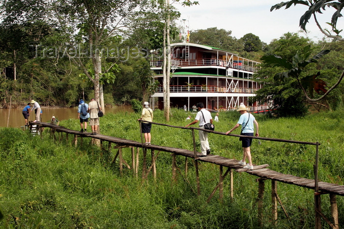 mal140: Rajang River, Sarawak, Borneo, Malaysia: passengers go ashore at a remote village - RV Orient Pandaw in background - rickety pier - photo by R.Eime - (c) Travel-Images.com - Stock Photography agency - Image Bank