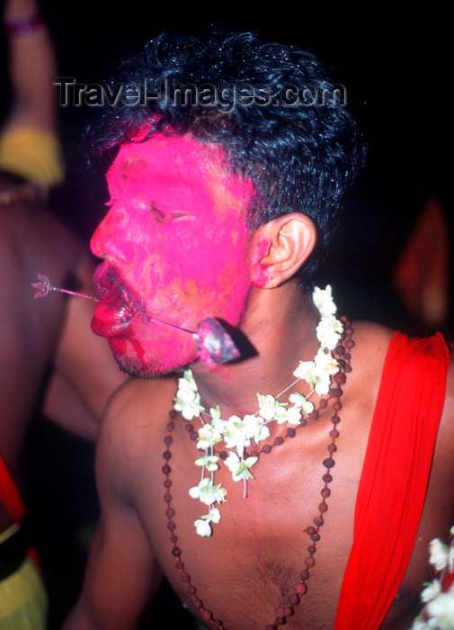 mal453: Batu Caves, Gombak, Selangor: Thaipusam Hindu festival - Vel kavadi - arrow across the face - commemorates both the birthday of Lord Murugan - photo by B.Lendrum - (c) Travel-Images.com - Stock Photography agency - Image Bank