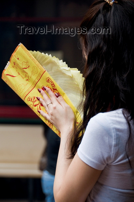 mal512: Kuala Lumpur, Malaysia: woman with paper offerings praying at Guandi Temple - photo by J.Pemberton - (c) Travel-Images.com - Stock Photography agency - Image Bank