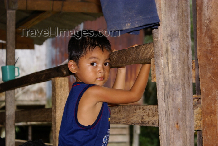 mal557: Skandis, Lubok Antu District, Sarawak, Borneo, Malaysia: young Iban boy, inside the longhouse - photo by A.Ferrari - (c) Travel-Images.com - Stock Photography agency - Image Bank