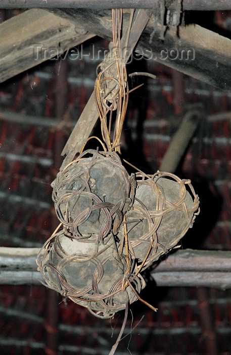 mal59: Malaysia - Sarawak - Bako: shrunken heads hang from in an Iban longhouse - headhunters trophies (photo by Rod Eime) - (c) Travel-Images.com - Stock Photography agency - Image Bank