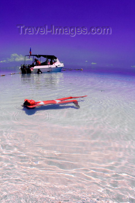 mal600: Pulau Mabul, Sabah, Borneo, Malaysia: girl in white bikini floating in clear water - photo by S.Egeberg - (c) Travel-Images.com - Stock Photography agency - Image Bank