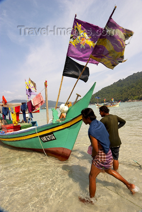 mal62: Malaysia - Pulau Perhentian / Perhentian Island, Terengganu: fishermen run - boats with flags (photo by Jez Tryner) - (c) Travel-Images.com - Stock Photography agency - Image Bank