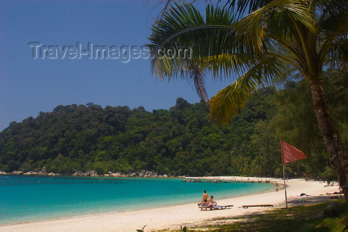 mal623: Perhentian Island, Terengganu, Malaysia: Perhentian Island Resort - Teluk Pauh - PIR- two people on white sandy beach lined by vegetation - photo by S.Egeberg - (c) Travel-Images.com - Stock Photography agency - Image Bank