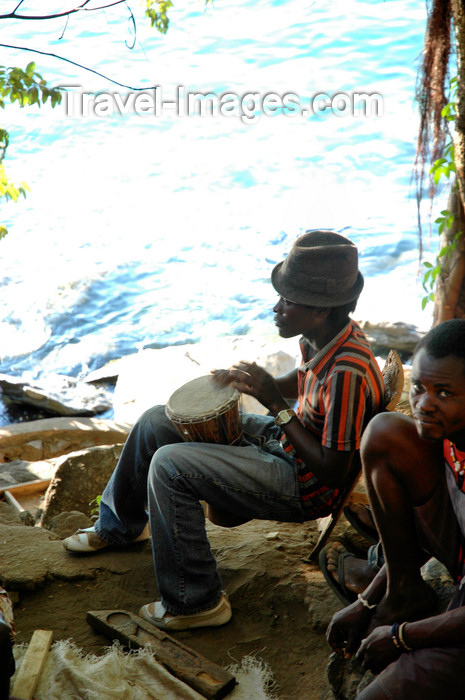 malawi7: Nkhata Bay, Lake Nyasa, Northern region, Malawi: drummer by the water - photo by D.Davie - (c) Travel-Images.com - Stock Photography agency - Image Bank