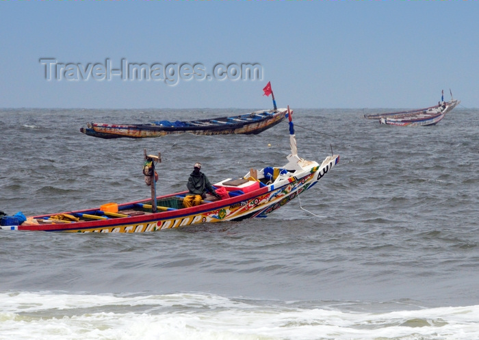 mauritania30: Nouakchott, Mauritania: a fisherman prepares to leave for the ocean on a wooden fishing boat - fishing harbor, the Port de Pêche - photo by M.Torres - (c) Travel-Images.com - Stock Photography agency - Image Bank