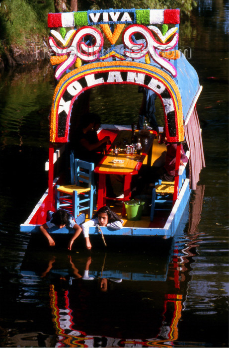 mexico340: Xochimilco, DF: children relax on a chalupa - canal view - photo by Y.Baby - (c) Travel-Images.com - Stock Photography agency - Image Bank