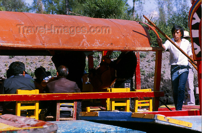 mexico342: Xochimilco, DF: chalupas and Mexican gondolier - photo by Y.Baby - (c) Travel-Images.com - Stock Photography agency - Image Bank