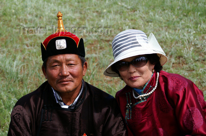 mongolia144: Ulan Bator / Ulaanbaatar, Mongolia: Naadam festival - Mongolian couple at the horse races - Hui Doloon Khutag - photo by A.Ferrari - (c) Travel-Images.com - Stock Photography agency - Image Bank