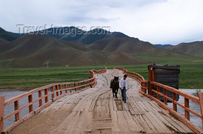 mongolia308: Khövsgöl province, Mongolia: young boy leading his horse on an old bridge, on the way to Mörön - photo by A.Ferrari - (c) Travel-Images.com - Stock Photography agency - Image Bank