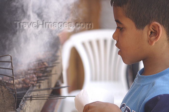moroc430: Asilah / Arzila, Morocco - boy buying kebabs - photo by Sandia - (c) Travel-Images.com - Stock Photography agency - Image Bank