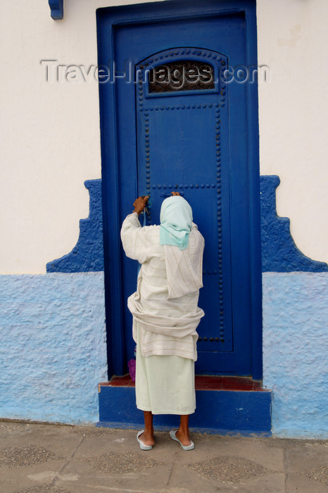 moroc434: Asilah / Arzila, Morocco - woman and blue door - Medina - photo by Sandia - (c) Travel-Images.com - Stock Photography agency - Image Bank